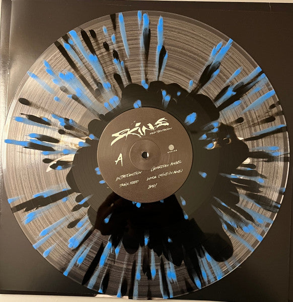 Skins (CLEAR + BLACK & BLUE SPLATTER VINYL) | Mint (M) Mint (M)