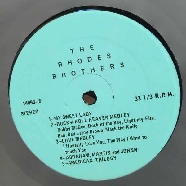The Rhodes Brothers *SIGNED* | Excellent (EX) Near Mint (NM)