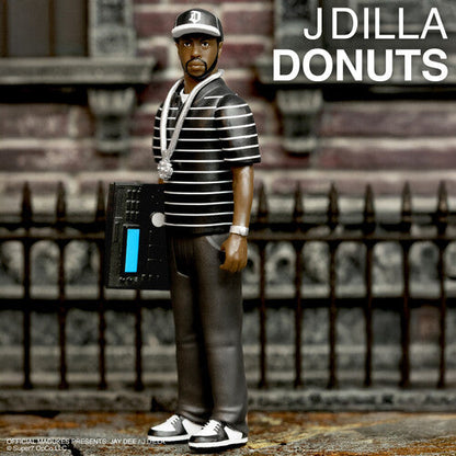 Super7 - J Dilla - ReAction Figures Wv1 - J Dilla (Donuts - Smile Album Cover) (Collectible, Action Figure) |